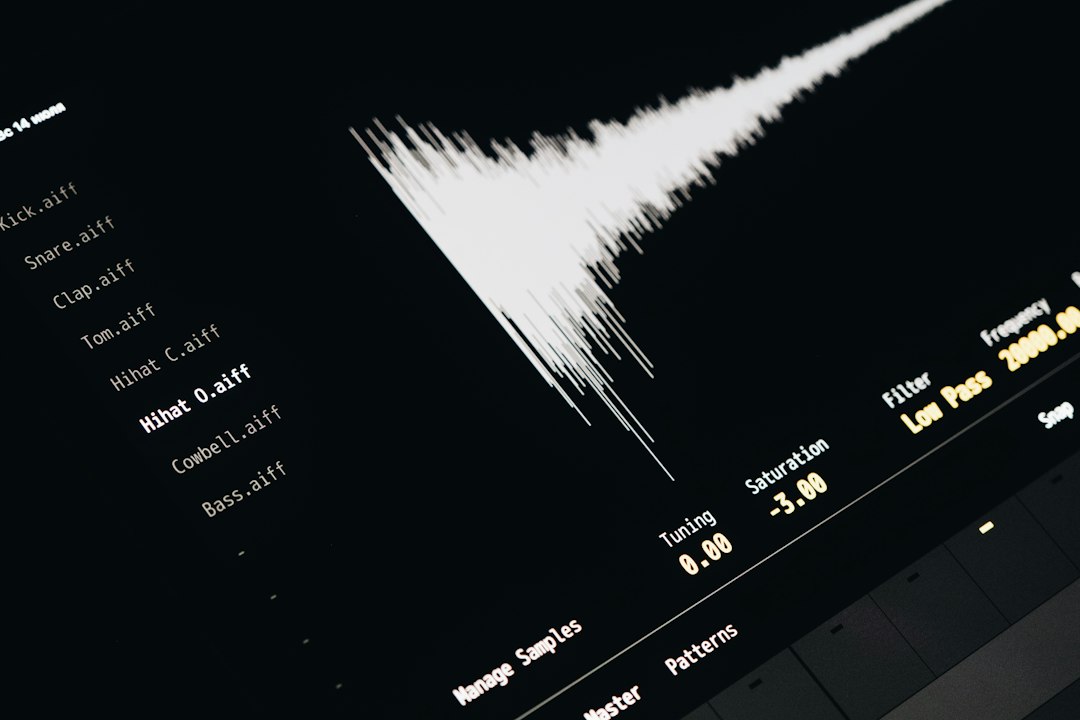 A screen displays a white audio waveform beside a list of sound files