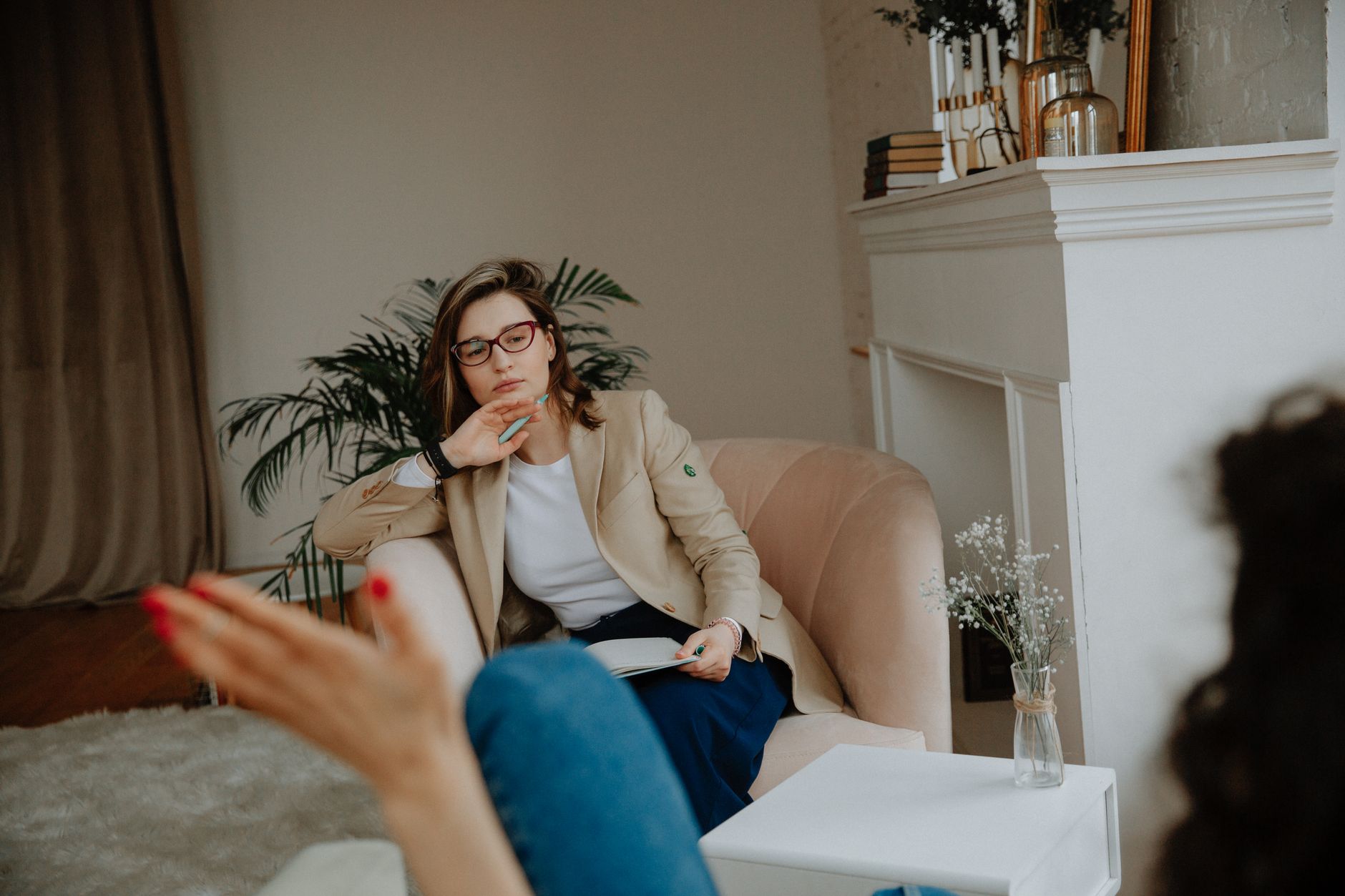 Thoughtful female psychologist listening to a patient during an ADHD therapy session in Lisbon