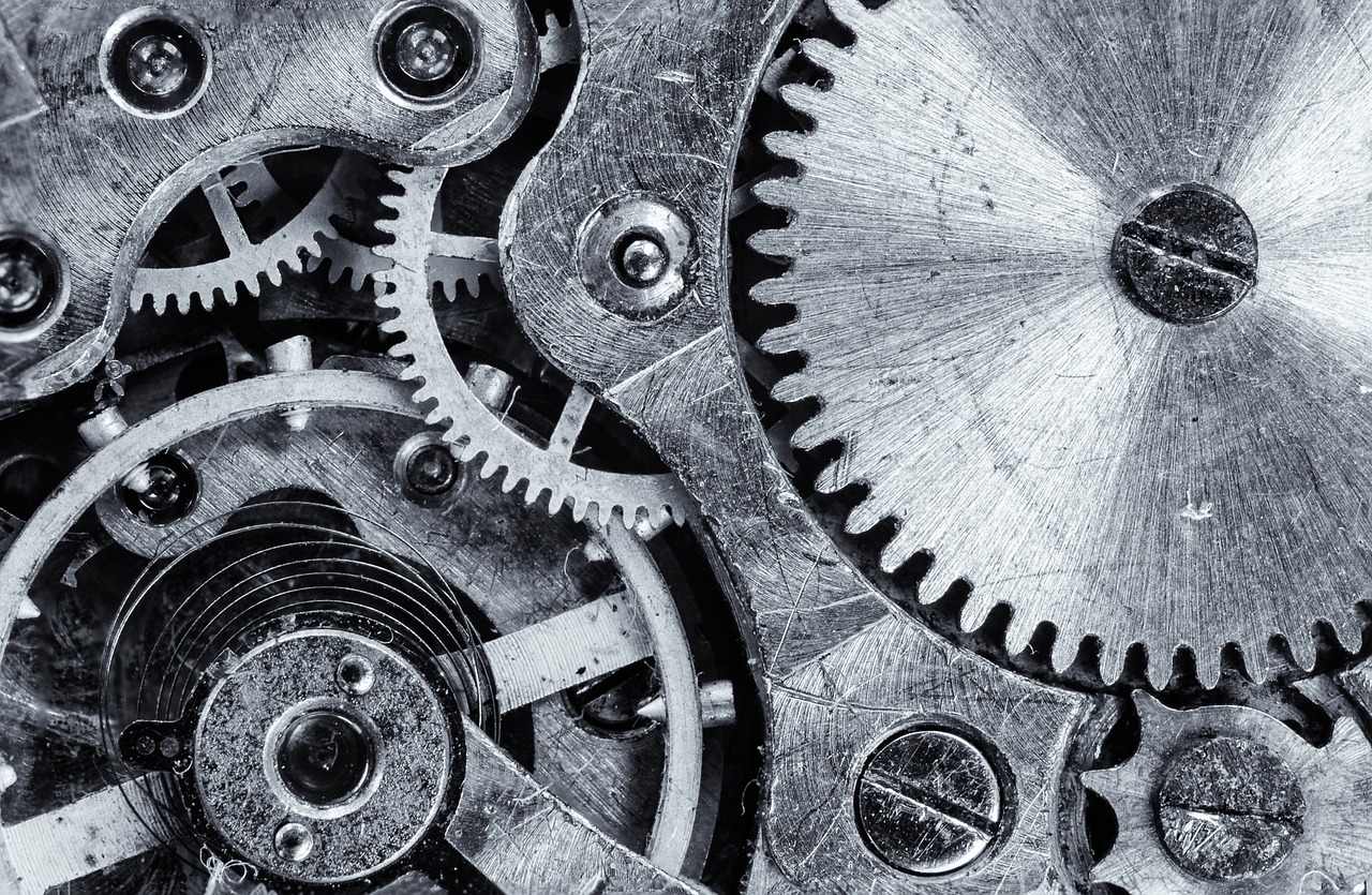 Close-up of intricate metal gears and springs representing complex internal mechanisms