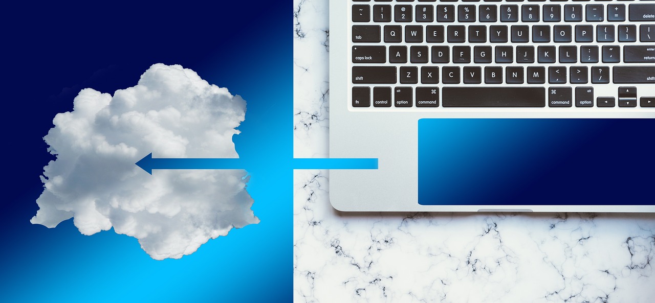 A cloud connected to a laptop keyboard by a blue arrow, symbolizing cloud computing