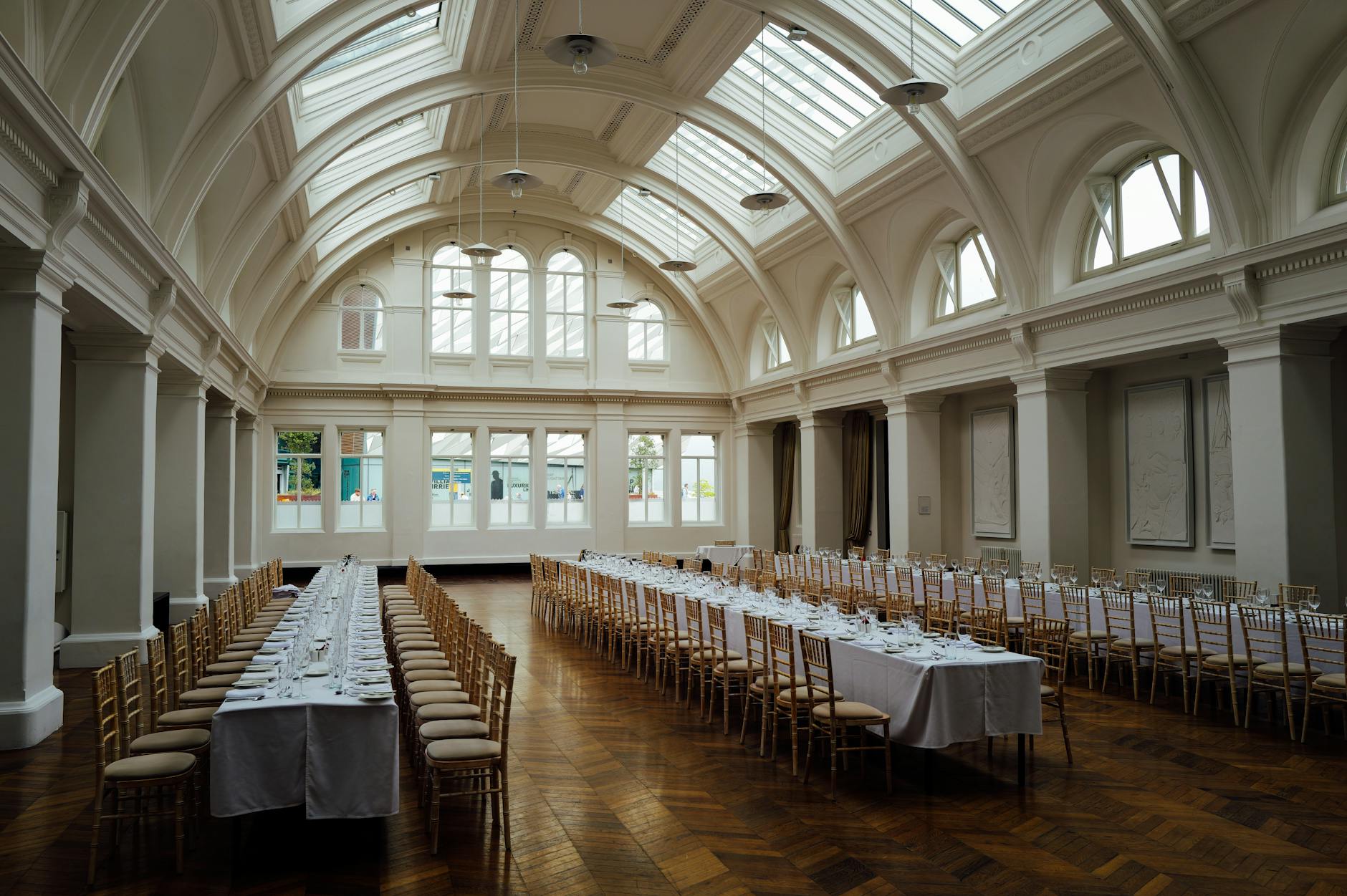 A beautifully decorated wedding hall at Regal Castle with chandeliers and floral arrangements. — Lagos Wedding