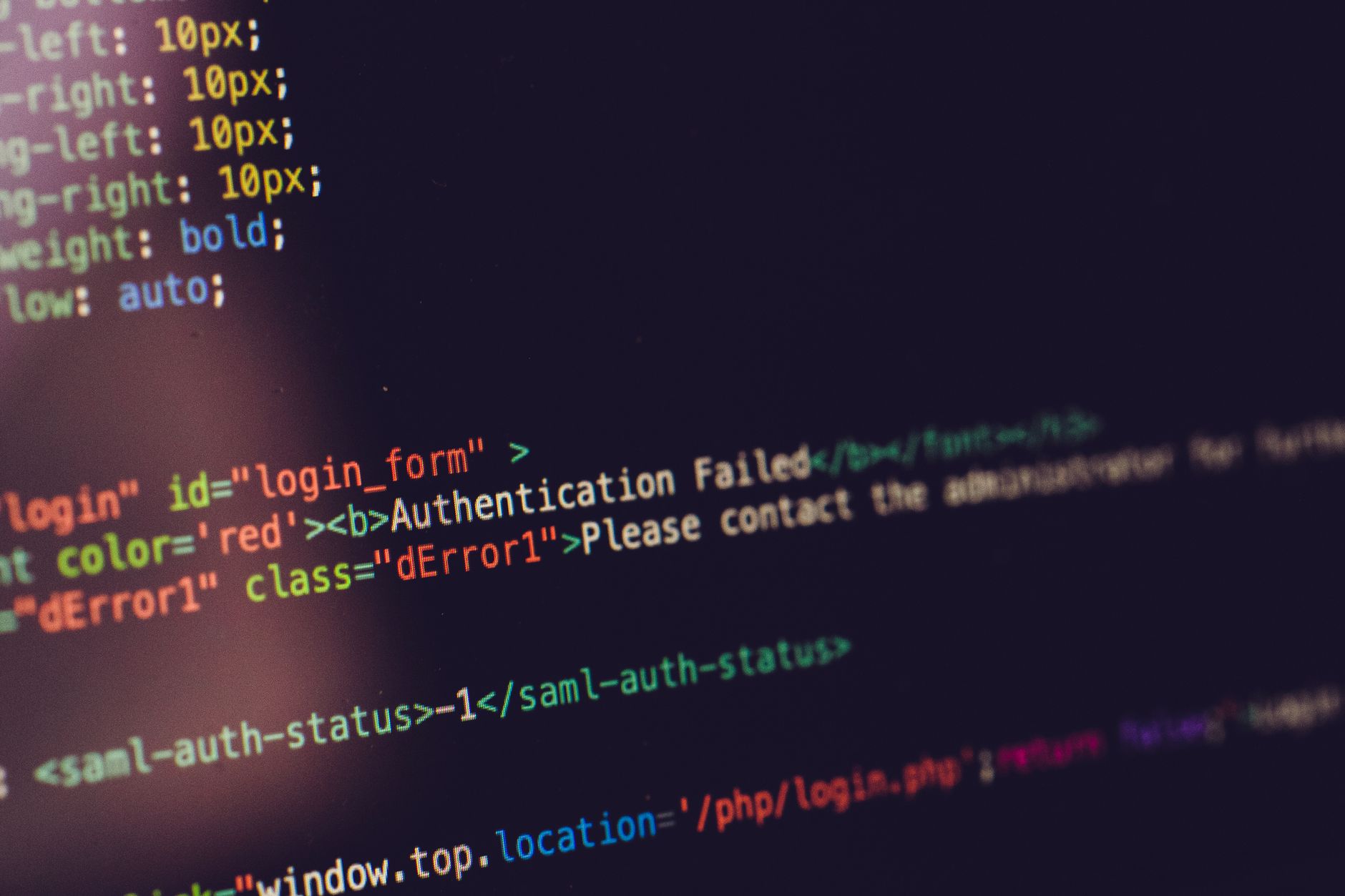 Lines of colored programming code displayed on a dark computer screen