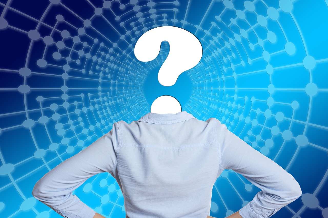 Person with a question mark for a head against a blue circuit pattern background