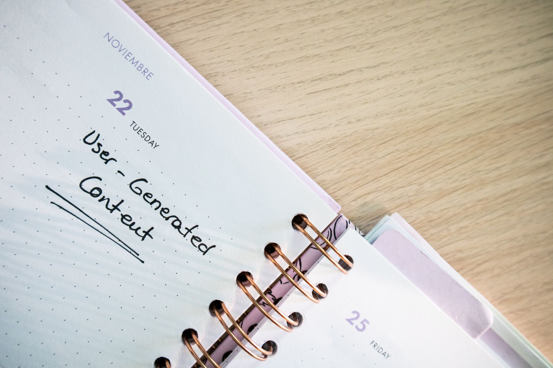 A planner open to November 22nd with "User-Generated Content" written on it