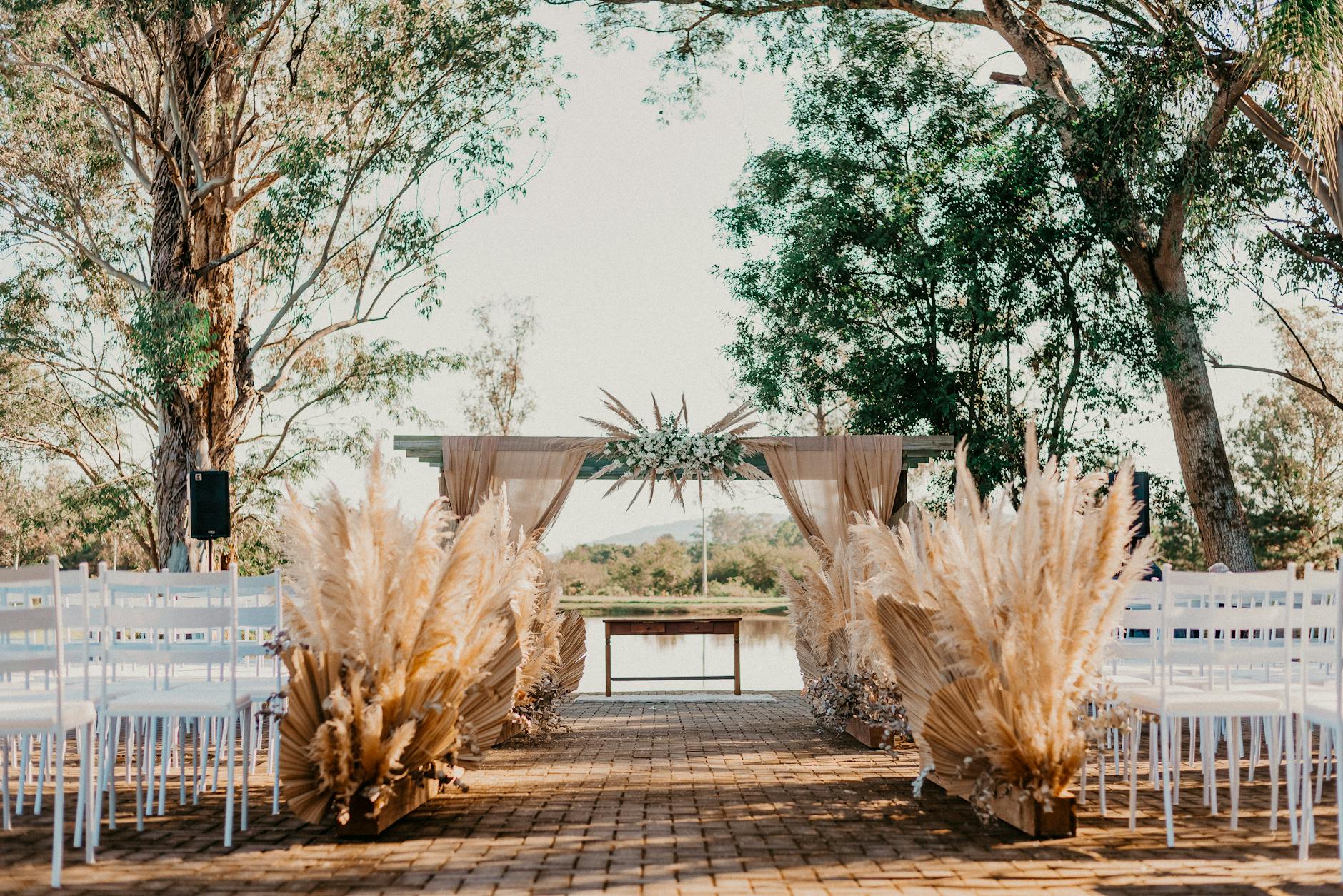 A wide shot of a beautiful, modern event center exterior at dusk — wedding venue near me