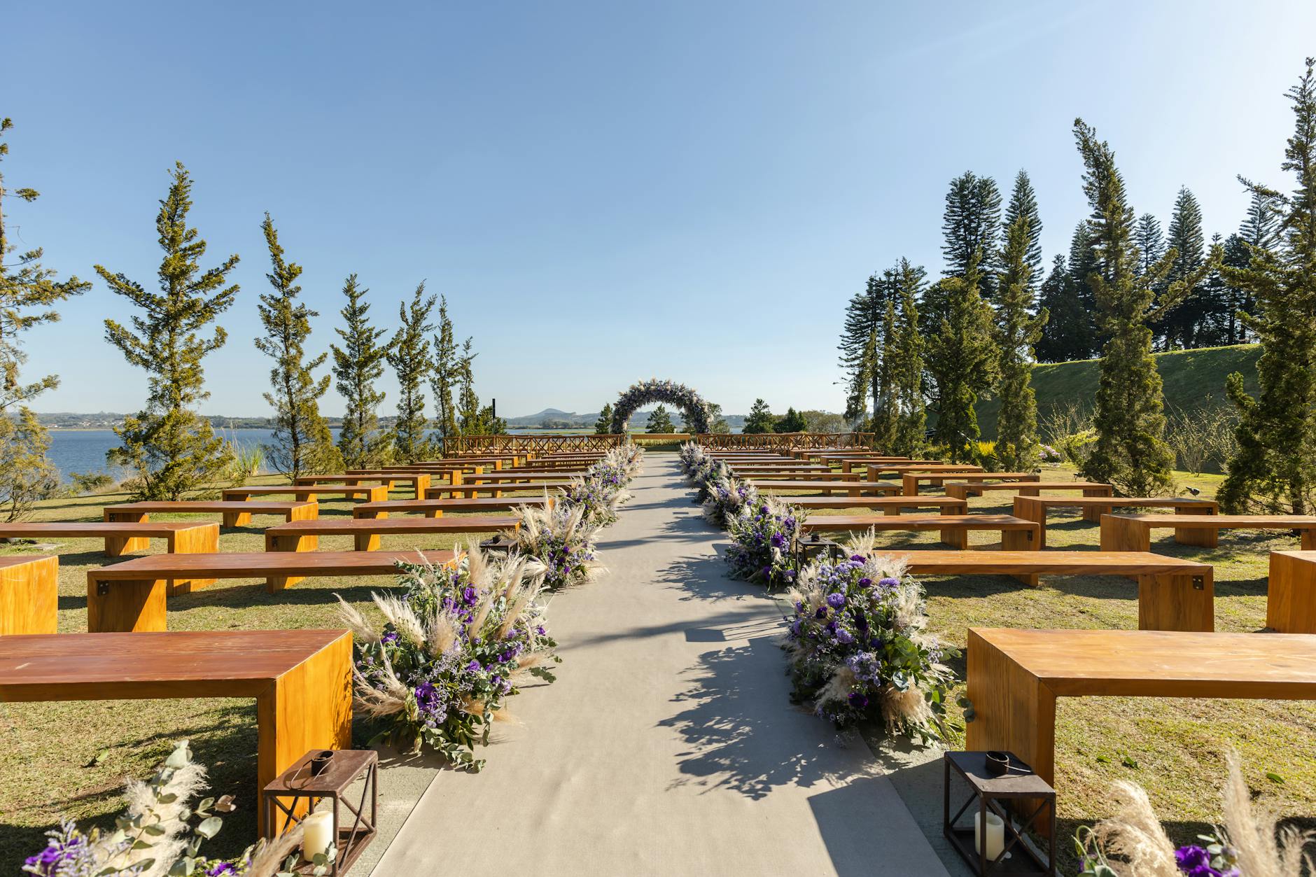 A smiling couple walking through a grand, beautifully decorated wedding hall — wedding venue near me