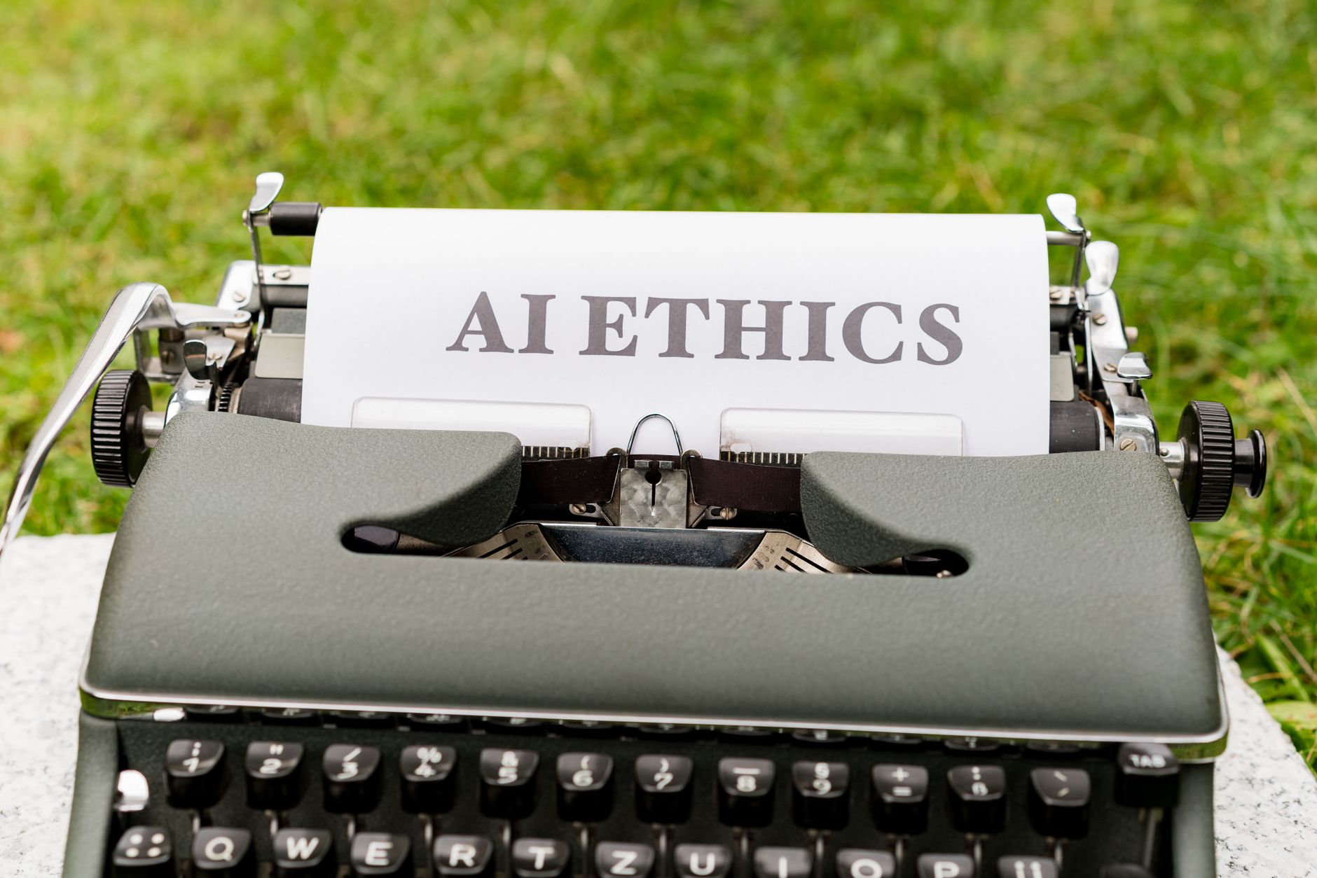 Vintage typewriter with "AI ETHICS" typed on paper, relating to AI content quality