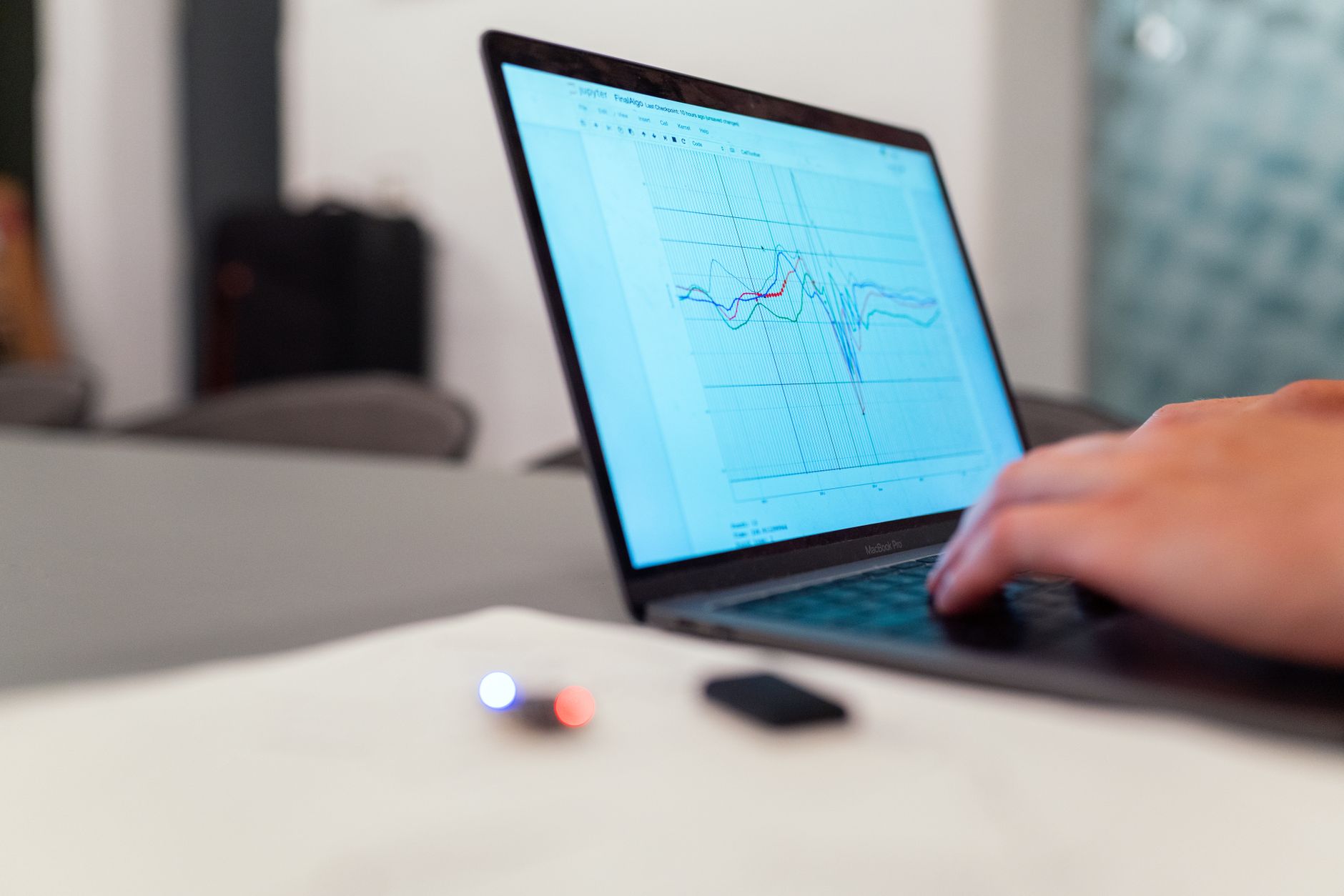 Person using a laptop to analyze complex website ranking metrics and charts