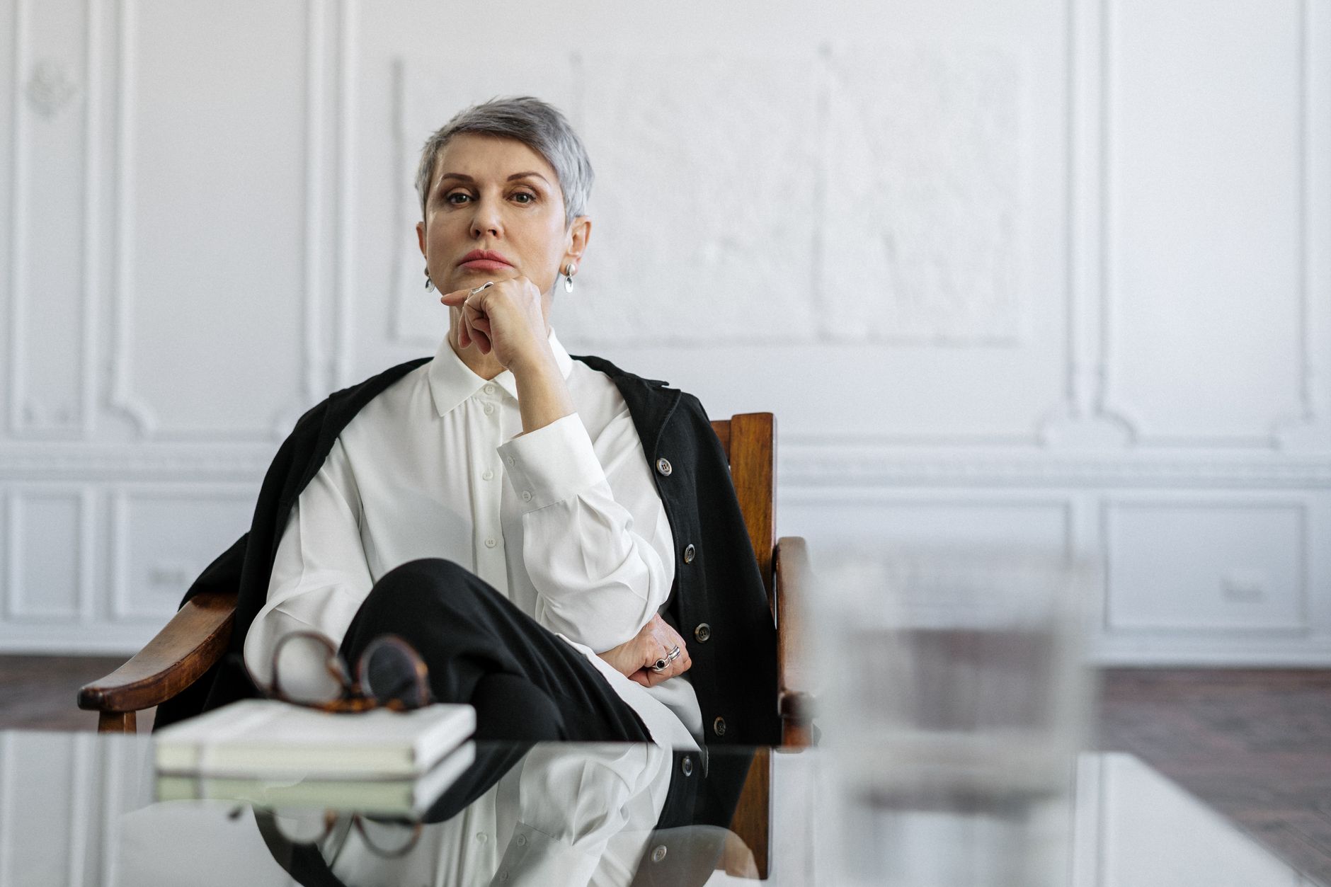 Woman psychologist sits thoughtfully in an office, defining her unique value proposition