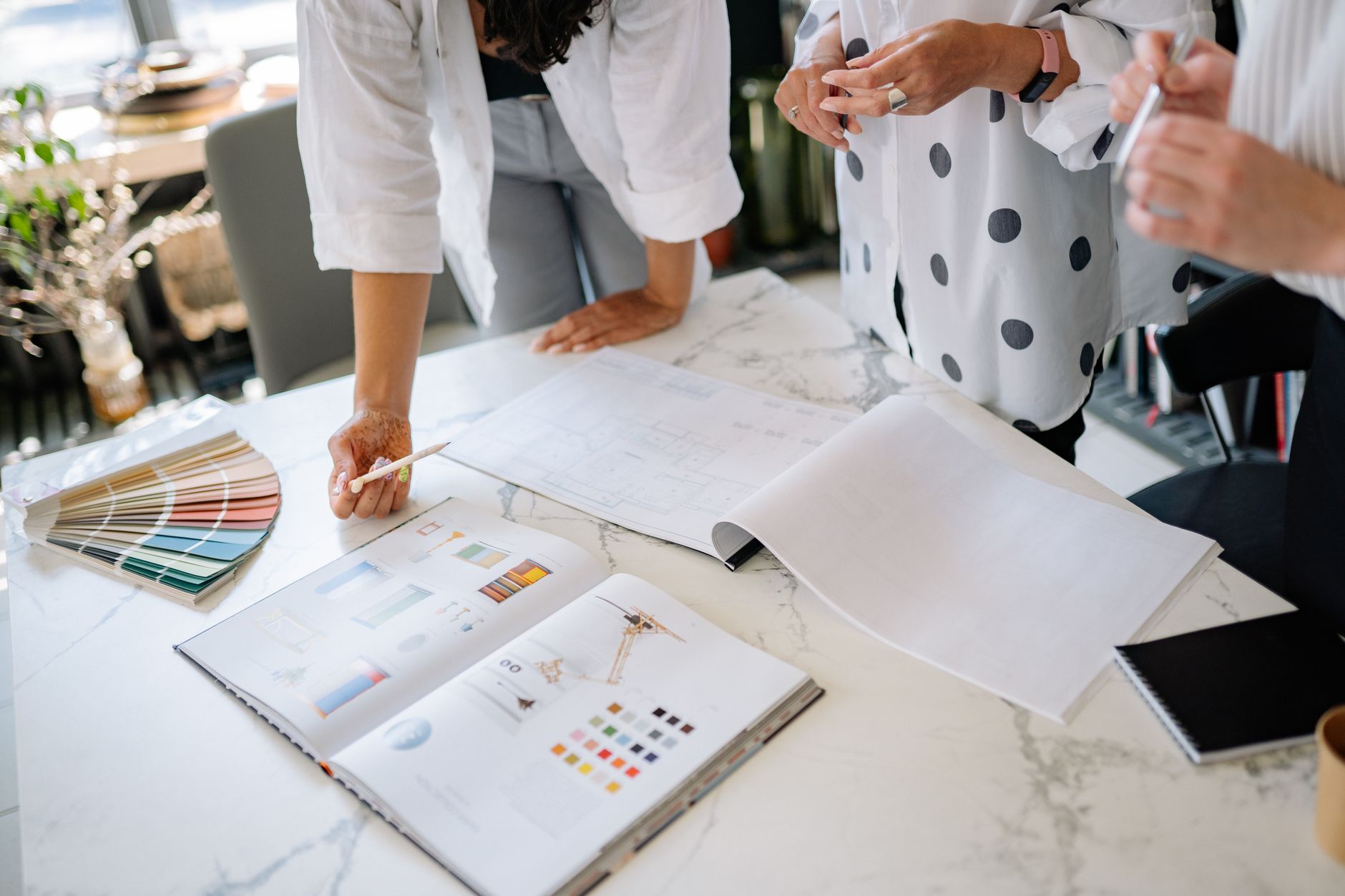 Design experts discuss color palettes and blueprints, planning a strategic branding approach