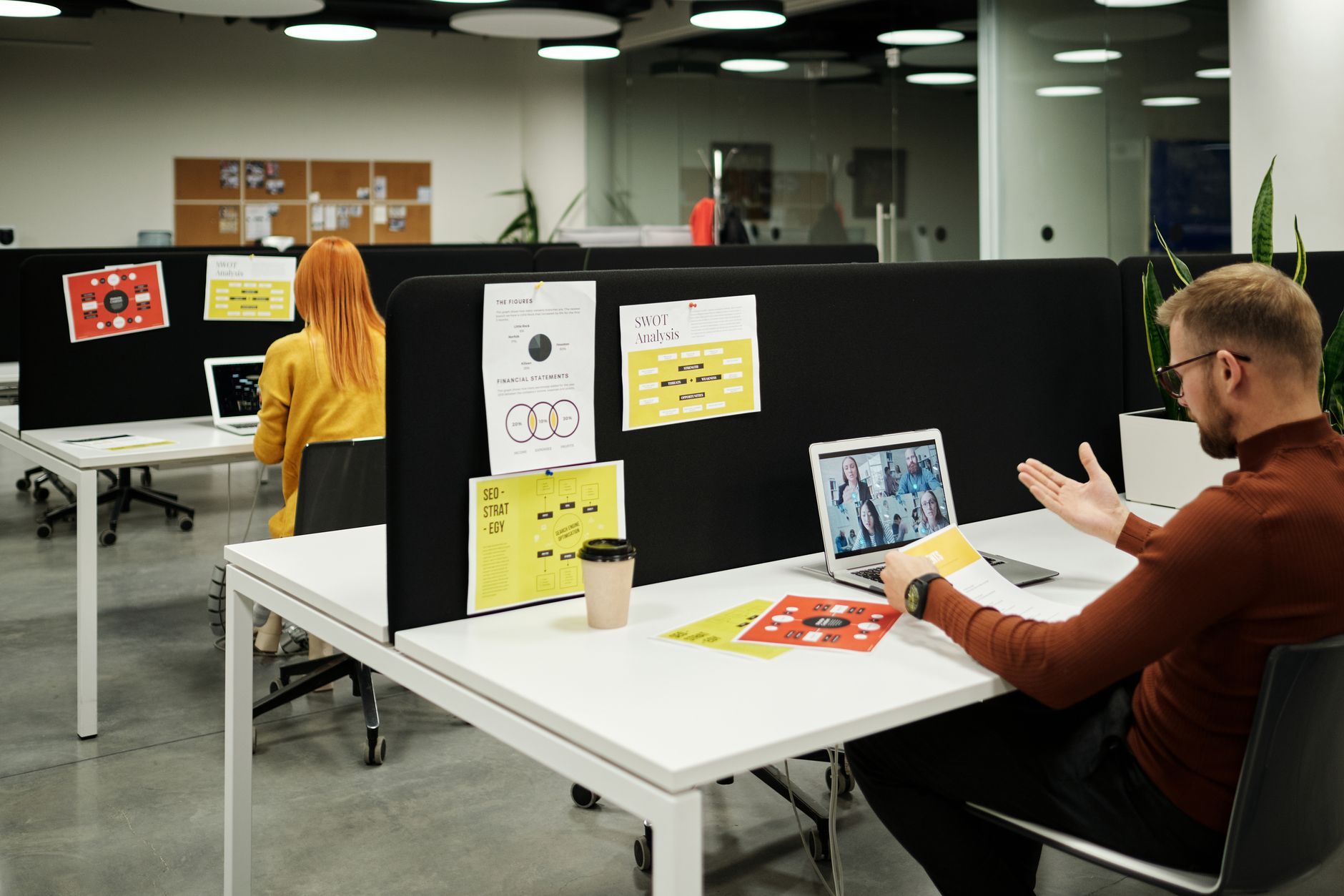 People in an office reviewing strategies like SWOT analysis and SEO for business consulting