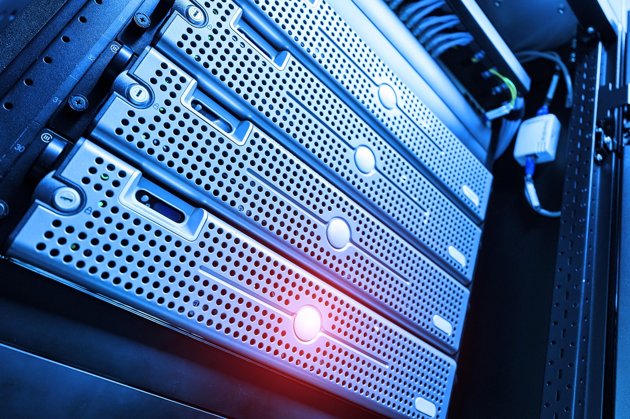 Close up of server racks with blue and red indicator lights in a data center