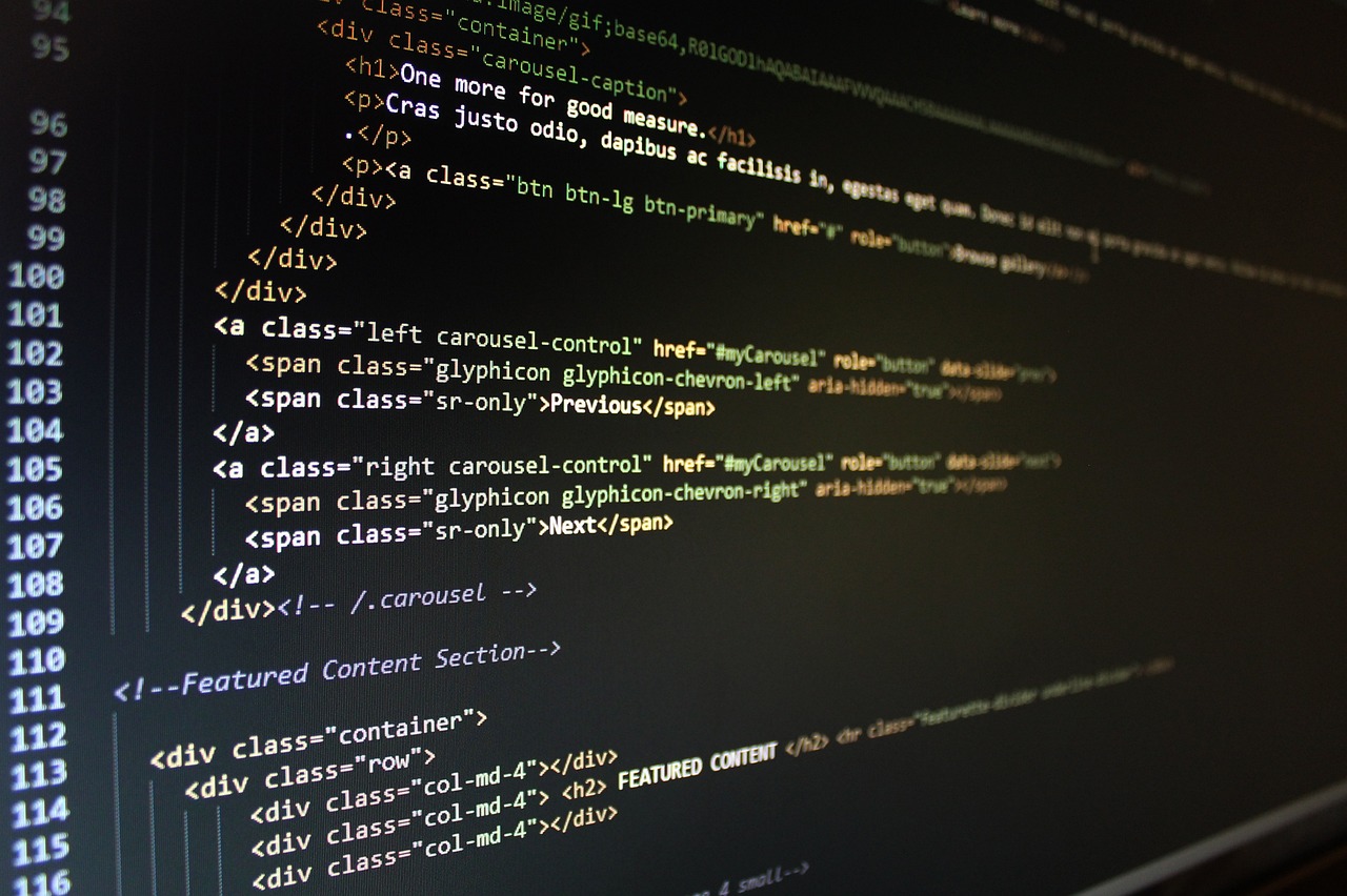 Lines of colorful HTML and CSS code on a dark screen for website optimization