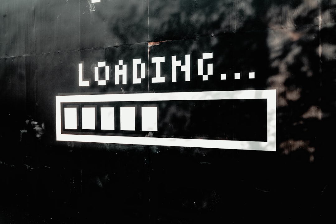 Pixelated "LOADING..." text and a progress bar on a dark background