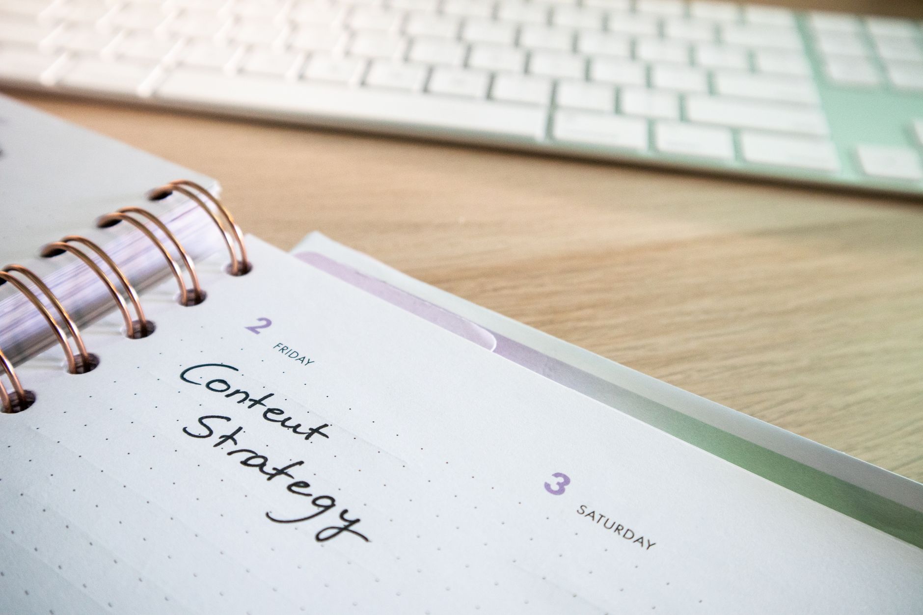 A planner with "Content Strategy" written, suggesting content planning for SEO tips
